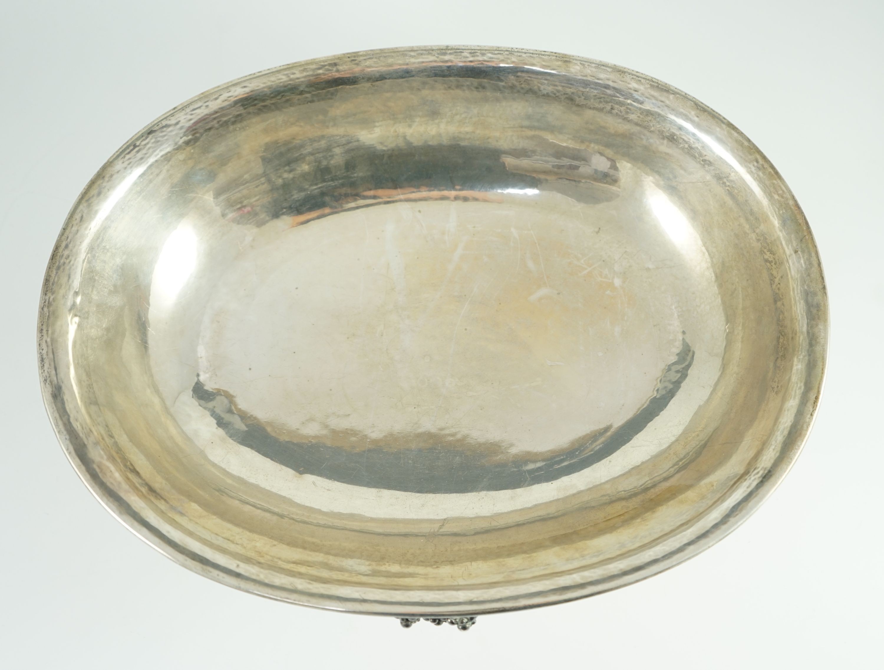 A good George V Georg Jensen planished silver Grape pattern oval pedestal fruit bowl, design no. 296